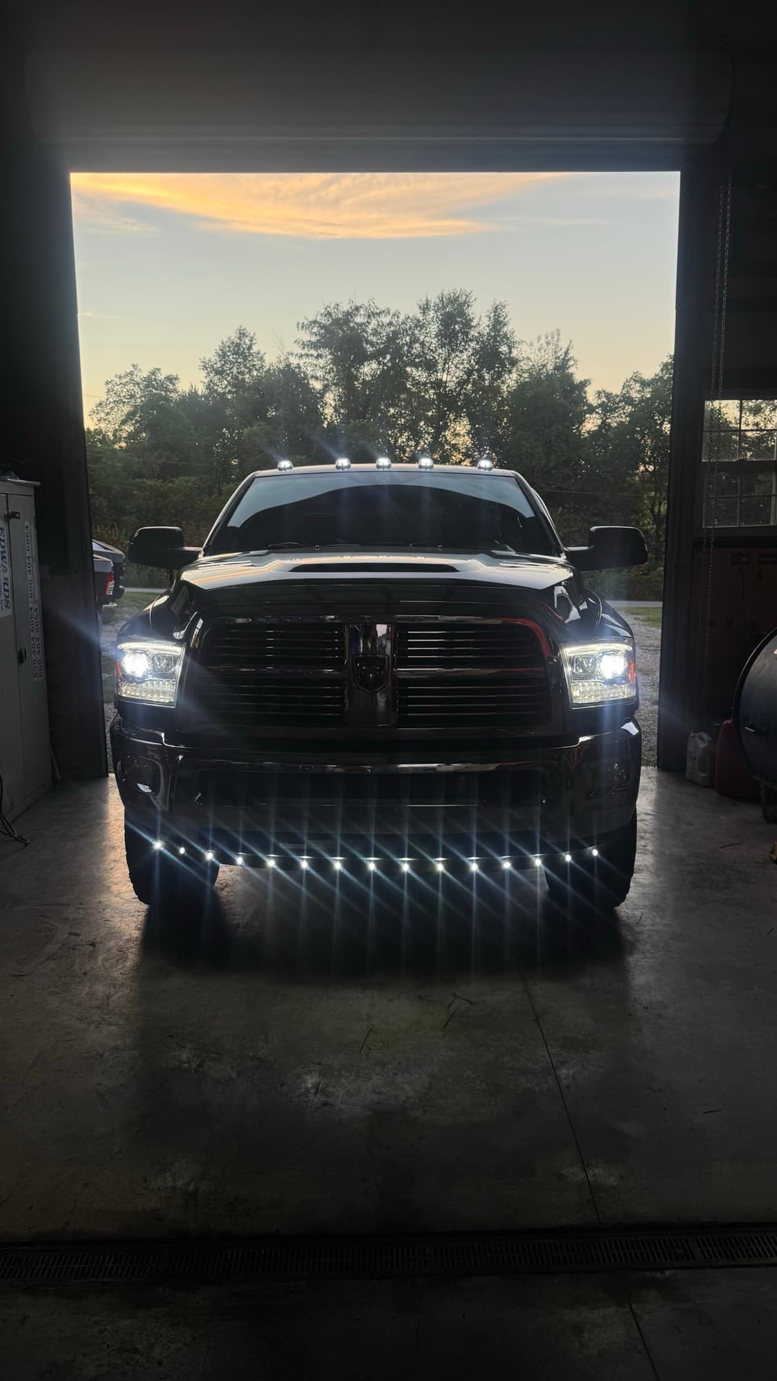 Ram at dusk with TS Diesel rock and wheel lights lit up